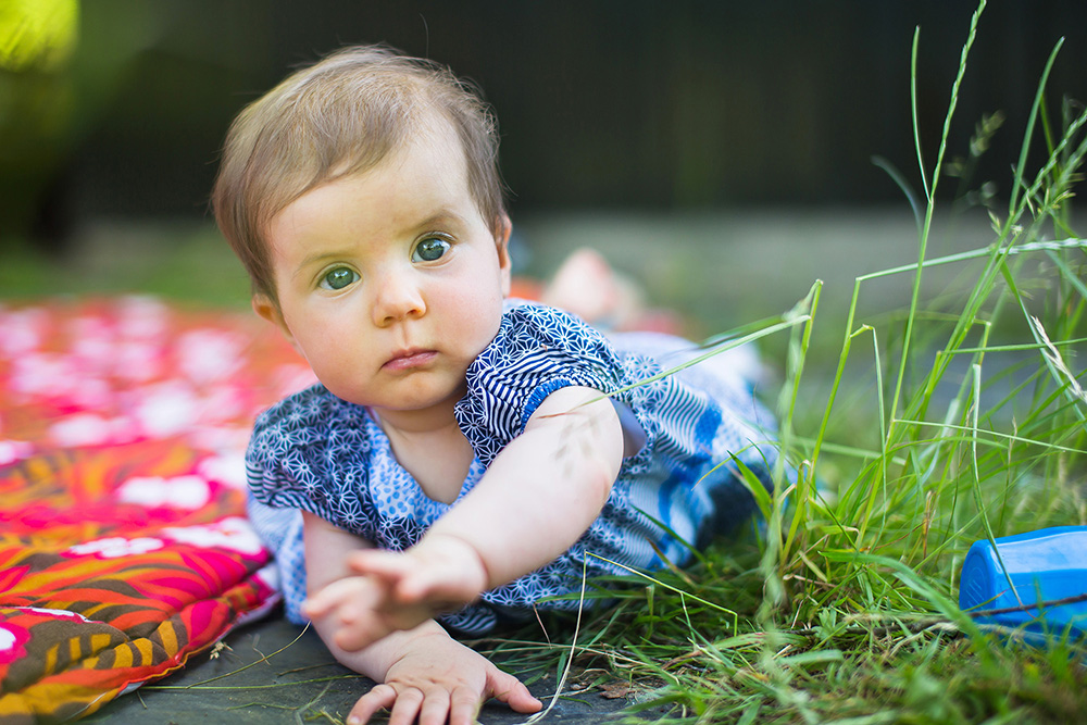 16a_baby-girl-playing-in-grass