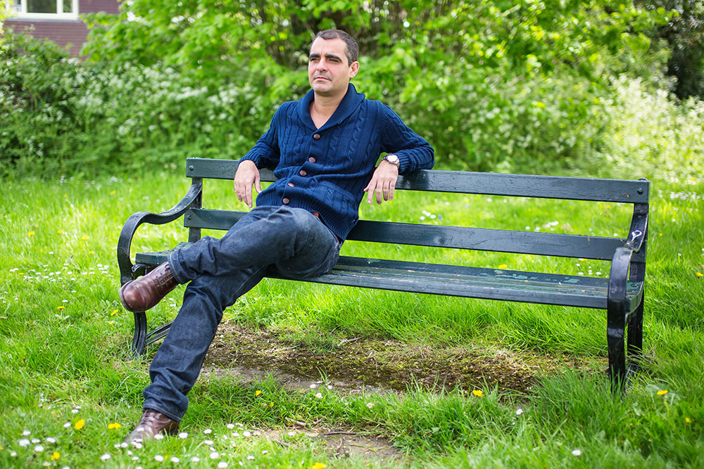 05_man-on-bench-green-portrait