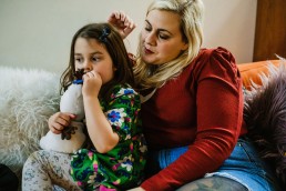 mummy and toddler girl on couch, documentary family photos south of England