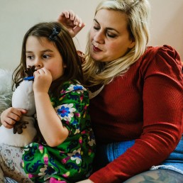 mummy and toddler girl on couch, documentary family photos south of England