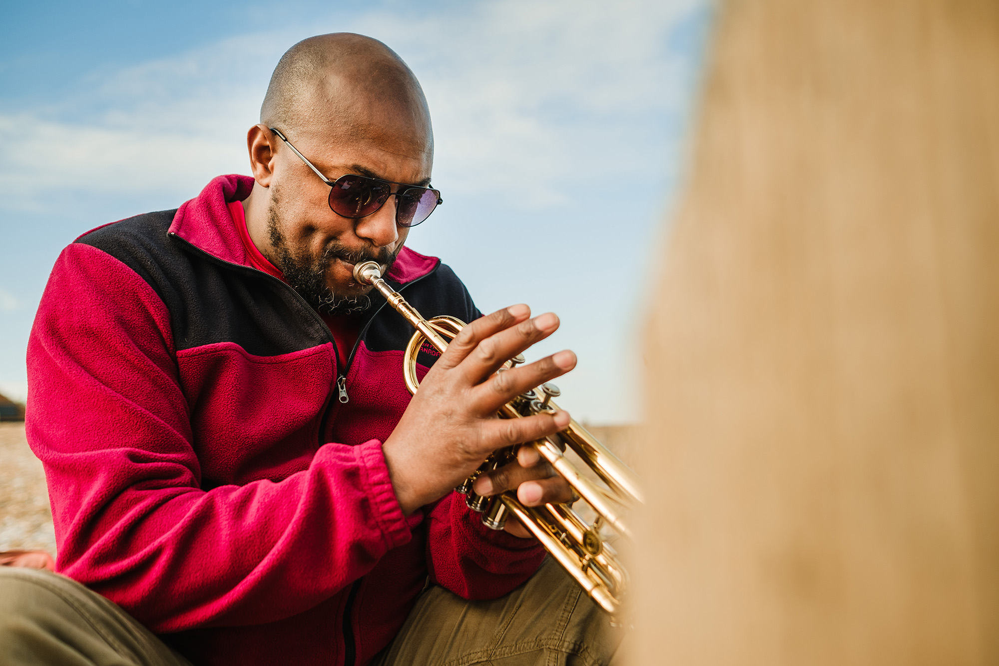 playing the trumpet at the beach