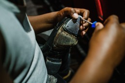 tap dancer fixing shoes