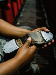 tap dancer fixing shoes