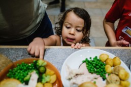 toddler grabbing dinner