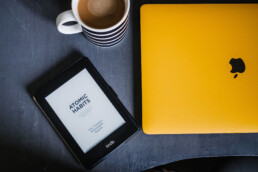 macbook and kindle and coffee