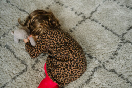 toddler on the floor hiding