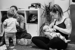 mum feeding baby in toddler group