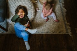 toddler and baby hanging out at home