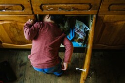 little boy in snack cupboard