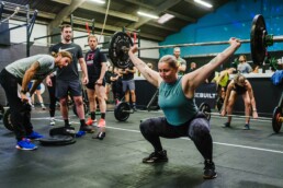 14 snatch female athlete with judges