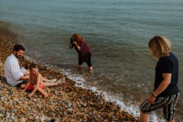 Anja-photographing-a-family-on-brighton-beach