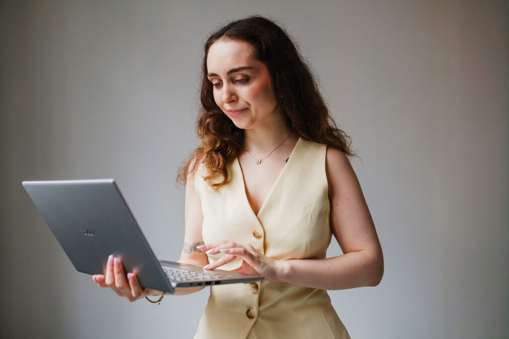 successful business woman VA on the go working on laptop 