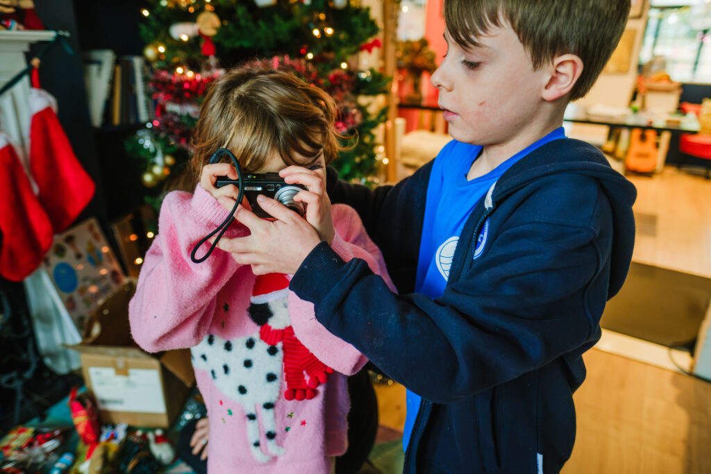 kids fighting over family camera