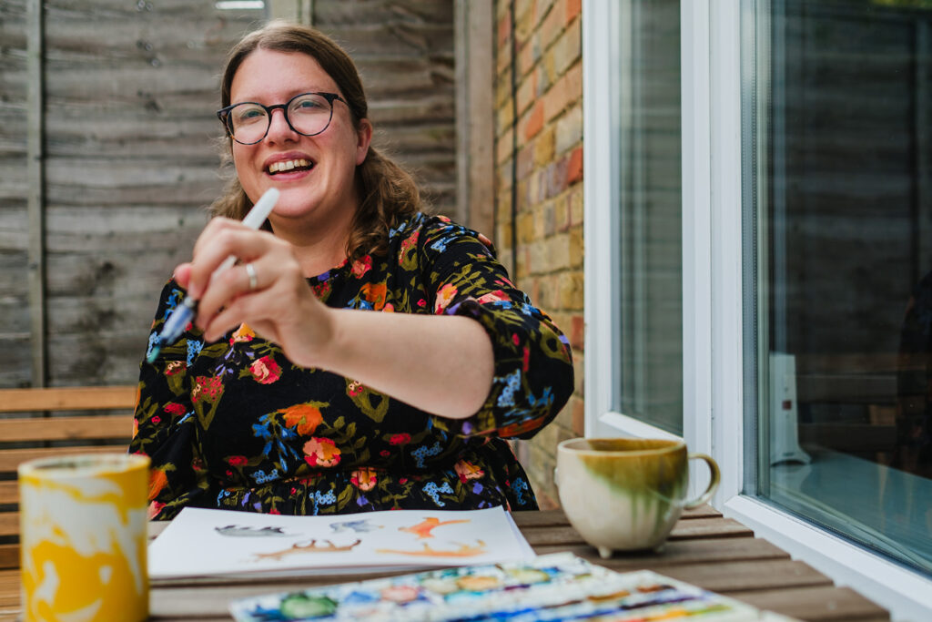 designer artist paining with watercolour makers of sussex